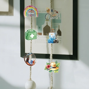 Waterproof travel stickers with retro bicycle and rainbow lettering on a string