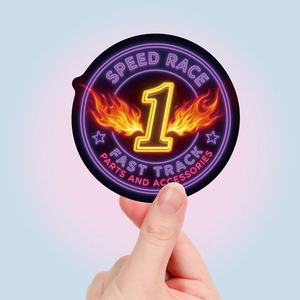 Close-up of a round neon racing sticker with yellow number one and flame wings design