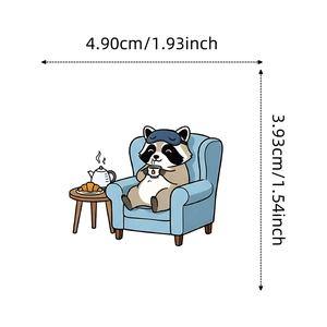 Detailed size view of a cartoon raccoon sticker sitting on a sofa with tea and croissant