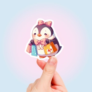Nahaufnahme eines süßen Pinguin-Aufklebers mit Einkaufstüten und rosa Schleife für Deko