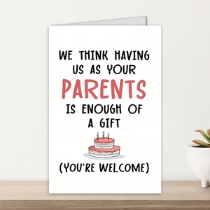 Creative birthday card with humorous text and cake illustration on a wooden desk
