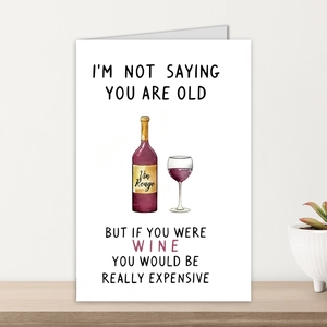 Detailed view of watercolor wine illustration and humorous message on funny birthday card