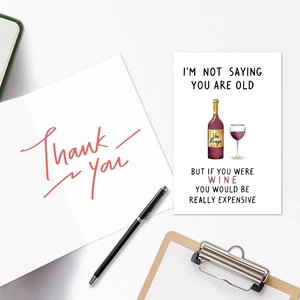 Funny birthday card set with wine illustration and thank you note on a clipboard