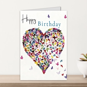 Detail of white birthday card with colorful butterfly heart and Happy Birthday message