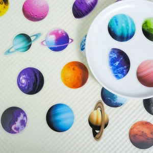 Scattered planet PET stickers with Saturn and Earth designs for creative decoration