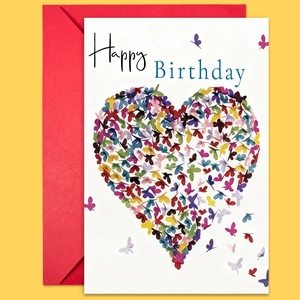 Close-up of birthday card with colorful butterfly heart design and a red envelope