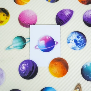 Macro view showing realistic solar system planet PET stickers with vibrant colors