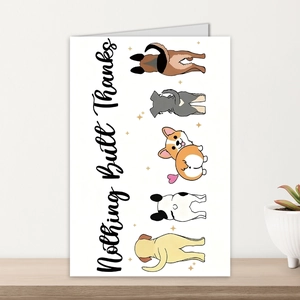 Detail of Thank You card with five cartoon dogs and Nothing Butt Thanks text on a desk