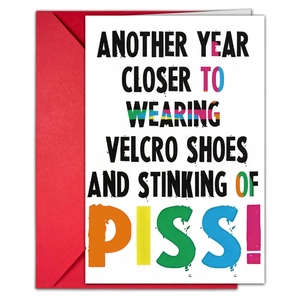 Funny birthday card with bold humor text and a vibrant red envelope set detail