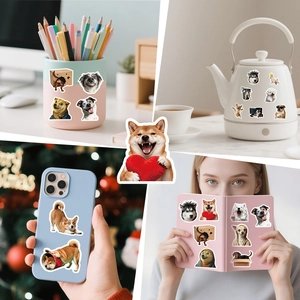 Dog stickers shown on a laptop, mug, and phone case for creative daily DIY decoration