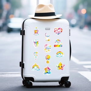 Colorful watercolor cartoon star and cloud stickers applied on a white travel suitcase