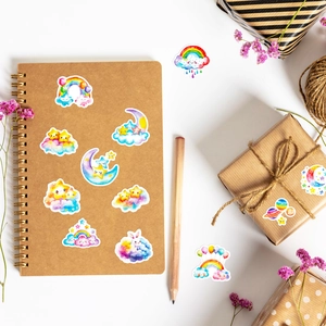 Waterproof cartoon star and cloud stickers applied on a notebook for DIY decoration