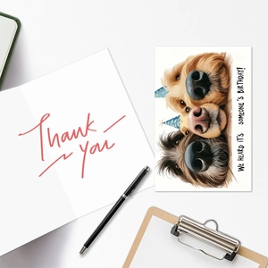Flat lay of large humor animal birthday cards with dogs and thank you note stationery