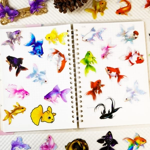Vibrant colorful goldfish PET sticker set on notebook for creative scrapbooking decor