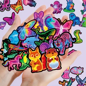 Close-up of vibrant neon animal stickers featuring colorful butterfly and tiger designs