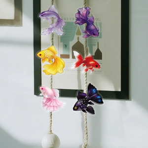 Creative display of colorful goldfish PET stickers hanging on rustic hemp rope decorations