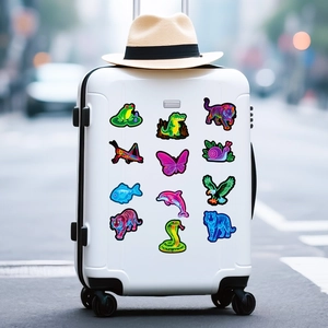 Neon animal graffiti stickers on white suitcase showing waterproof vinyl decal details