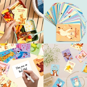 Detail of cute animal lunch box notes and gift cards with encouraging English phrases