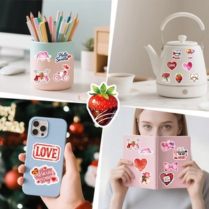 Detail of Valentine heart stickers applied to phone cases, water bottles and notebooks