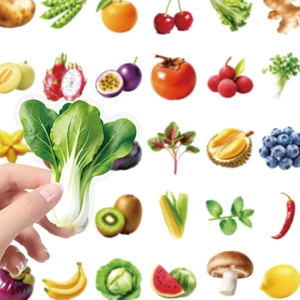 Detailed view of realistic transparent PET fruit and vegetable stickers held by hand