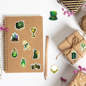 Detail of green forest magic stickers featuring potion bottles on vintage notebook