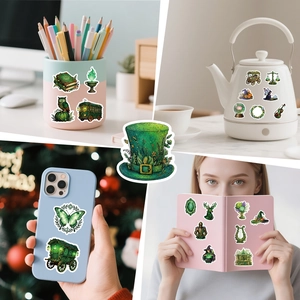 Waterproof magic forest stickers shown on phone case, notebook, and water bottle