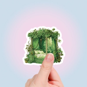 Detail of hand holding a green magic forest gazebo sticker with fantasy design