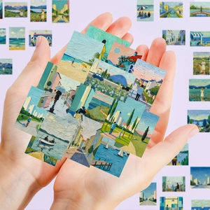 Close-up of artistic oil painting stickers featuring scenic city and beach landscapes