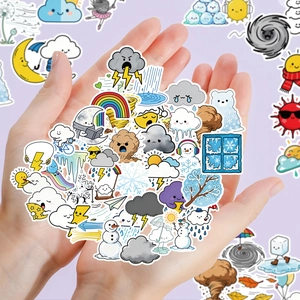 Close-up of cute weather stickers being held, showing vibrant sun and cloud designs