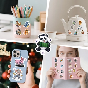 Detailed view of cartoon animal band stickers applied on a phone case and notebook