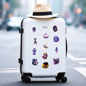 Detail of purple magic witch stickers applied on white suitcase for travel decoration