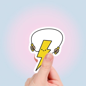 Close-up of cute cartoon yellow lightning sticker jumping rope with a smooth white border