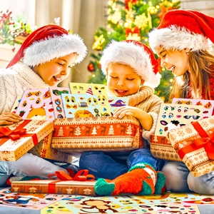 Three happy children opening a gift box filled with DIY cartoon animal face sticker sets