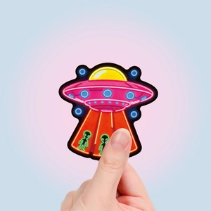 Dettaglio dell'adesivo graffiti UFO neon con due sagome di alieni su superficie lucida