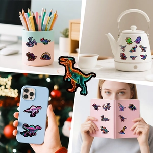 Vibrant neon dinosaur stickers applied to personal items like laptops and water bottles