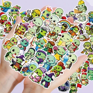 Detail showing a hand holding various cute cartoon turtle stickers for water bottles