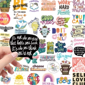 Close-up showing a high-quality matte inspirational vinyl sticker on a laptop surface