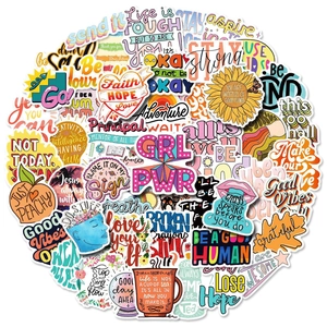 Close-up of assorted waterproof vinyl stickers with positive quotes and vibrant illustrations