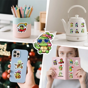 Detail view of cute cartoon turtle stickers applied on everyday objects like mugs and phones.
