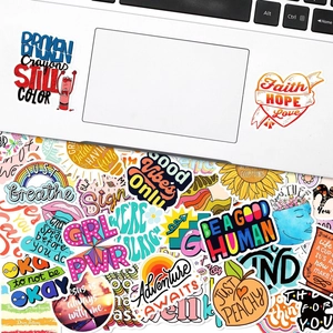 Detail showing waterproof inspirational stickers applied on a laptop case and grouped