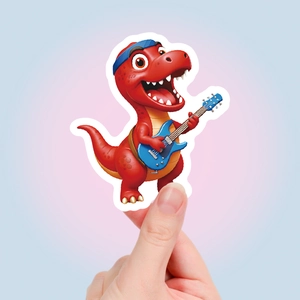 Close-up of a 3D cartoon dinosaur sticker featuring a T-Rex playing electric guitar