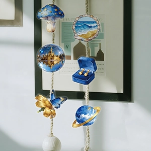 Detail of dreamlike Klein blue and gold PET stickers featuring mystical stars and castles