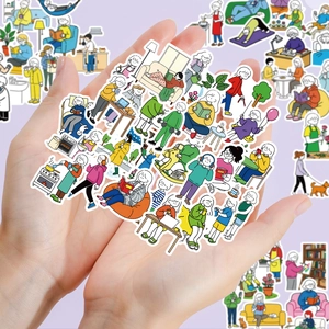 Detail of waterproof cartoon lifestyle stickers for journaling held in hands