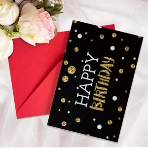 Detail of neon birthday card with gold glitter lettering and matching red envelope