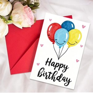 Detail of neon birthday card with colorful balloons and a bright red envelope