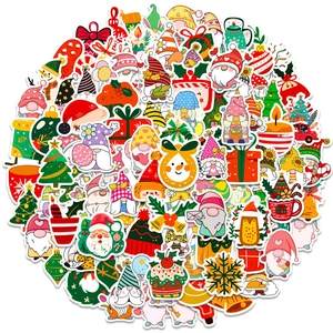 Flat lay macro of various colorful Christmas PVC stickers for DIY laptop and phone decoration