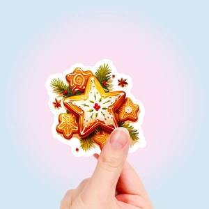 Detail of hand-held vintage Christmas gingerbread star sticker with festive berries