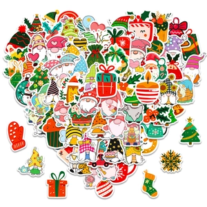 Creative heart-shaped collage of colorful Christmas stickers on a clean white background