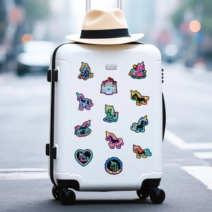 Neon unicorn stickers on white suitcase with a straw hat and blurred street background