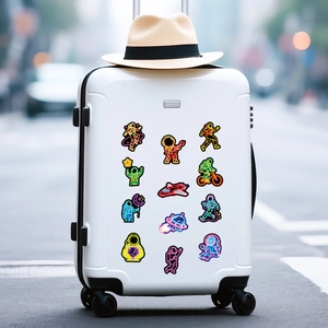 Neon astronaut stickers shown on a white suitcase in a trendy travel setting